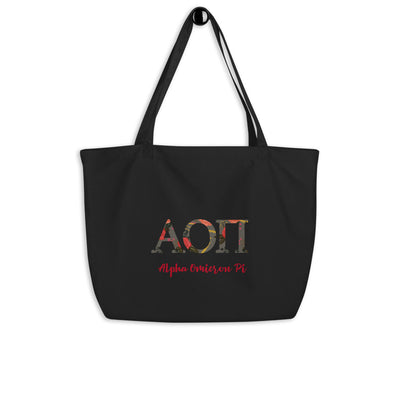 Alpha Omicron Pi Greek Letters Large Organic Eco Tote Bag shown in black on a hook