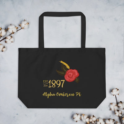 Alpha Omicron Pi 1897 Founders Day Large Organic Tote Bag in black shown flat with cotton flowers
