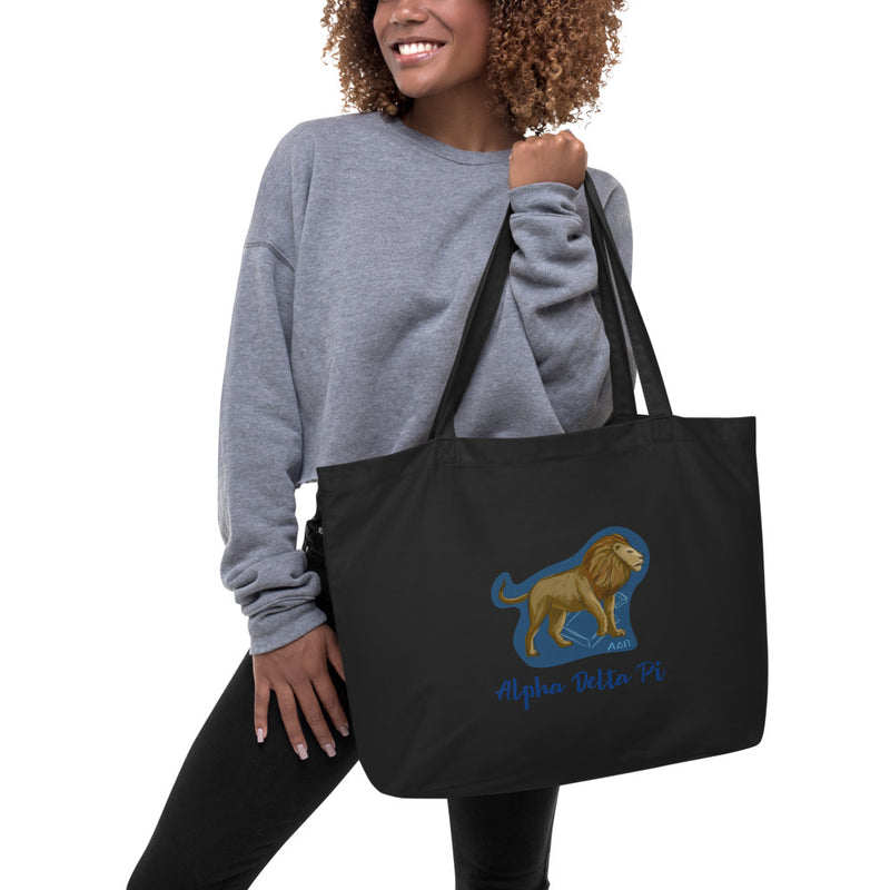Alpha Delta Pi Alphie The Lion Large Organic Tote Bag shown in black on woman&