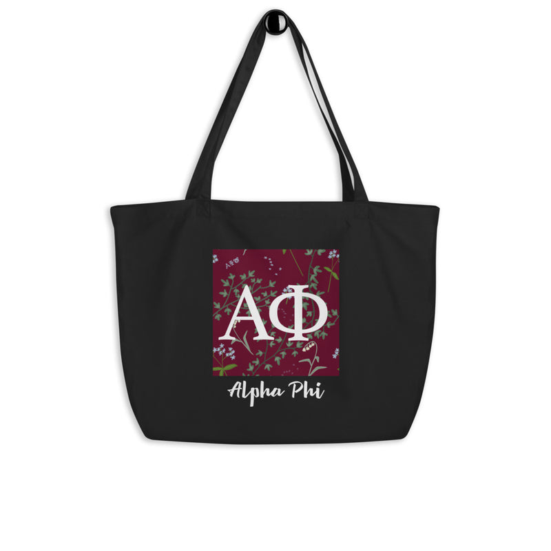 Alpha Phi Greek Letters Large Organic Eco Tote Bag in black shown on a hook