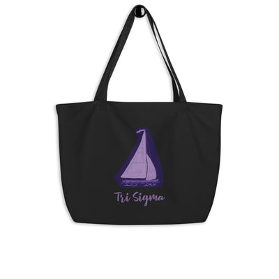 Tri Sigma Sailboat Mascot Large Organic Tote Bag in black shown on a hook