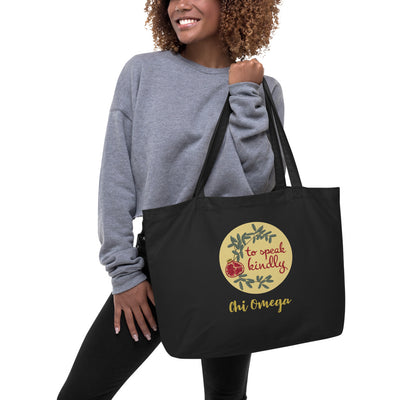 Chi Omega To Speak Kindly Large Organic Tote Bag shown in black on model's arm