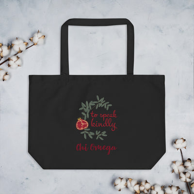 Chi Omega To Speak Kindly Large Organic Tote Bag shown in black on a hook
