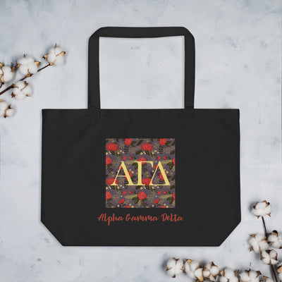 Alpha Gamma Delta Greek Letters Large Organic Tote Bag in black shown with cotton