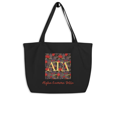 Alpha Gamma Delta Greek Letters Large Organic Tote Bag in black shown on hook