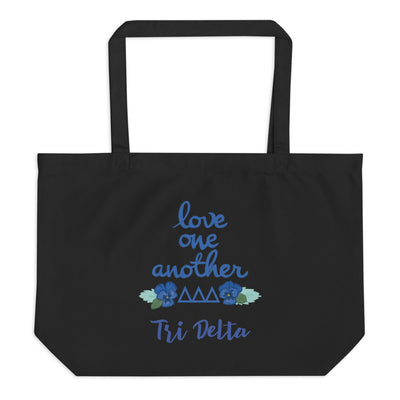 Tri Delta Love One Another Large Organic Tote Bag shown in black, flat