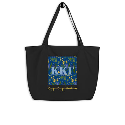 Kappa Kappa Gamma Greek Letters surrounded with a blue iris and key print printed on a black canvas shopping tote.