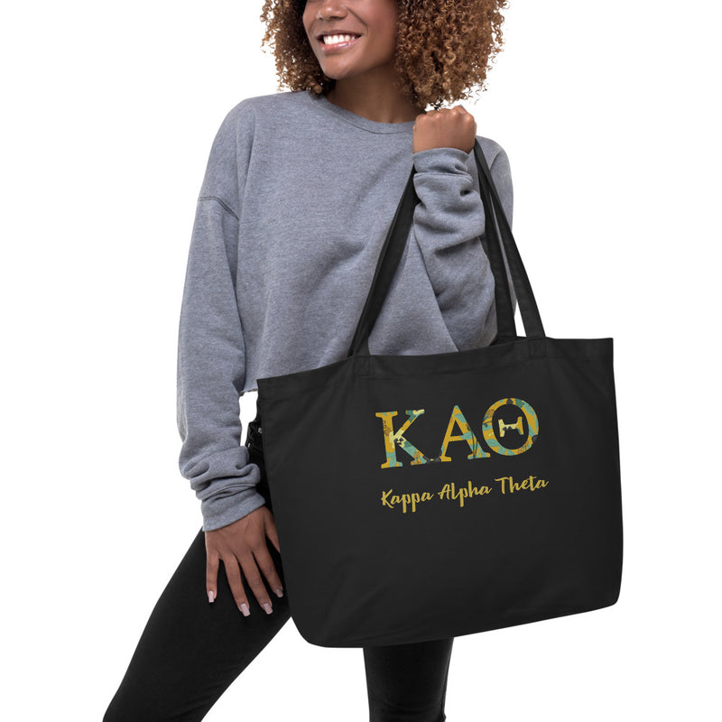 Kappa Alpha Theta Greek Letters Large Organic Tote Bag in black on model