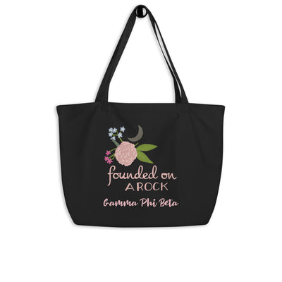 Gamma Phi Beta Founded on a Rock Large Organic Tote Bag shown on a hook in black