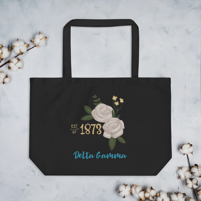 Delta Gamma 1873 Founders Day Large Organic Tote Bag shown with cotton blossoms