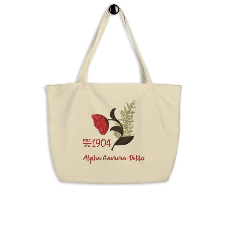 Alpha Gamma Delta 1904 Founders Day Large Organic Tote Bag shown in natural oyster on a hook