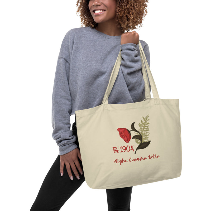 Alpha Gamma Delta 1904 Founders Day Large Organic Tote Bag shown in natural oyster color on model&
