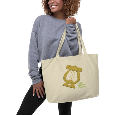 Alpha Chi Omega Real Strong Women Large Organic Tote Bag shown in natural oyster color on woman's arm