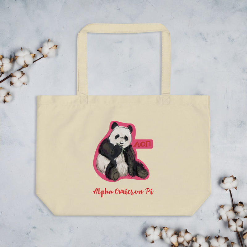 Alpha Omicron Pi Panda Large Organic Tote Bag shown in natural oyster color flat with cotton