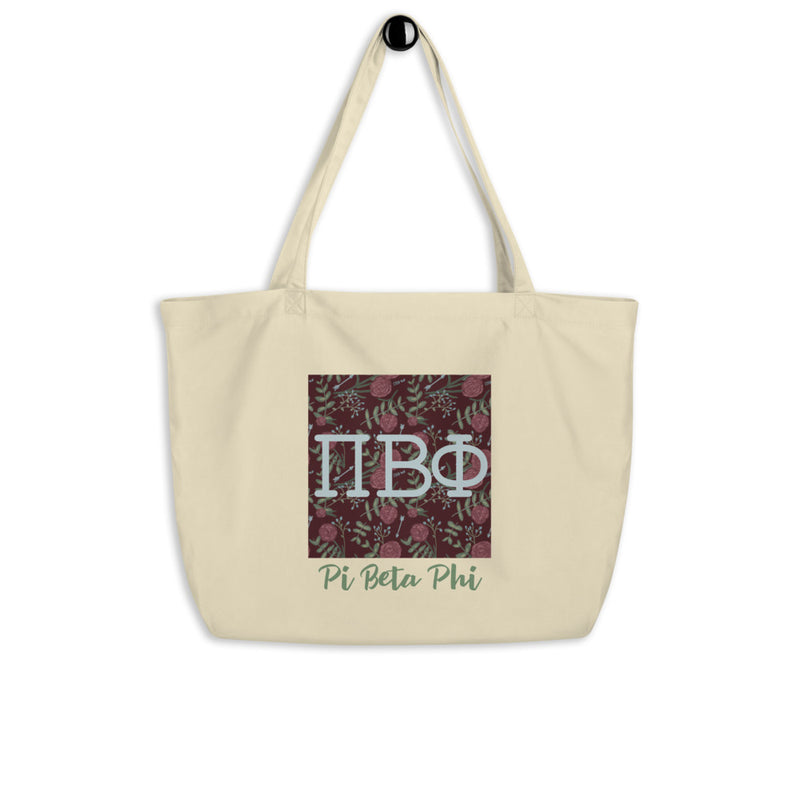 Pi Beta Phi Greek Letters Large Organic Tote Bag in natural shown on hook