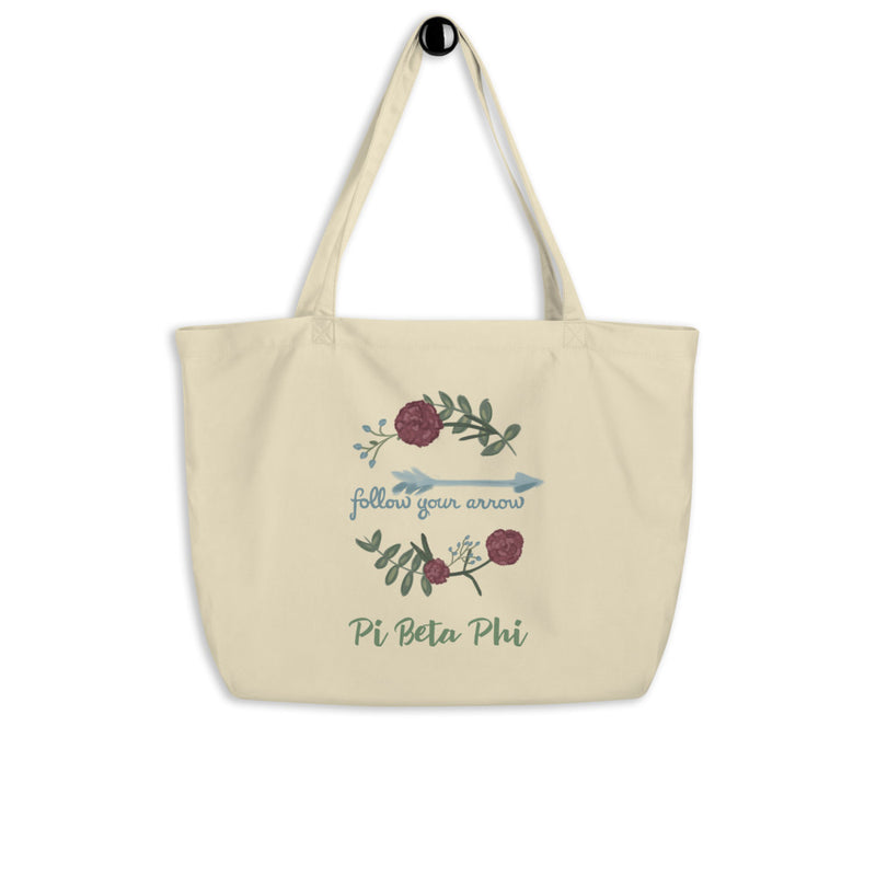 Pi Beta Phi Follow Your Arrow Large Organic Tote Bag in natural shown on a hook