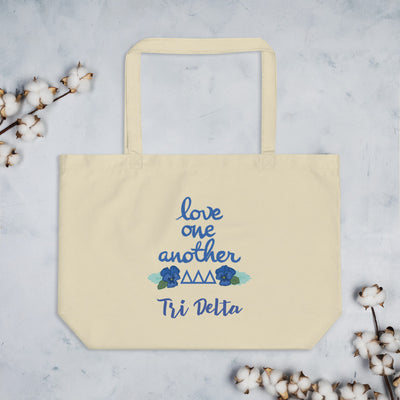Tri Delta Love One Another Large Organic Tote Bag shown in natural oyster color