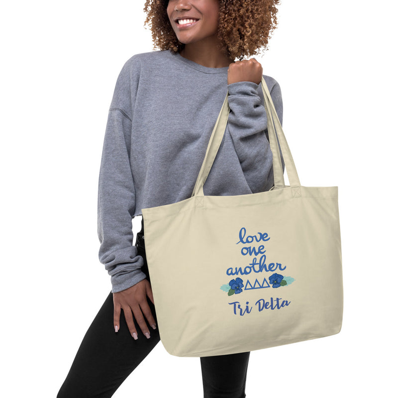 Tri Delta Love One Another Large Organic Tote Bag shown in natural oyster color