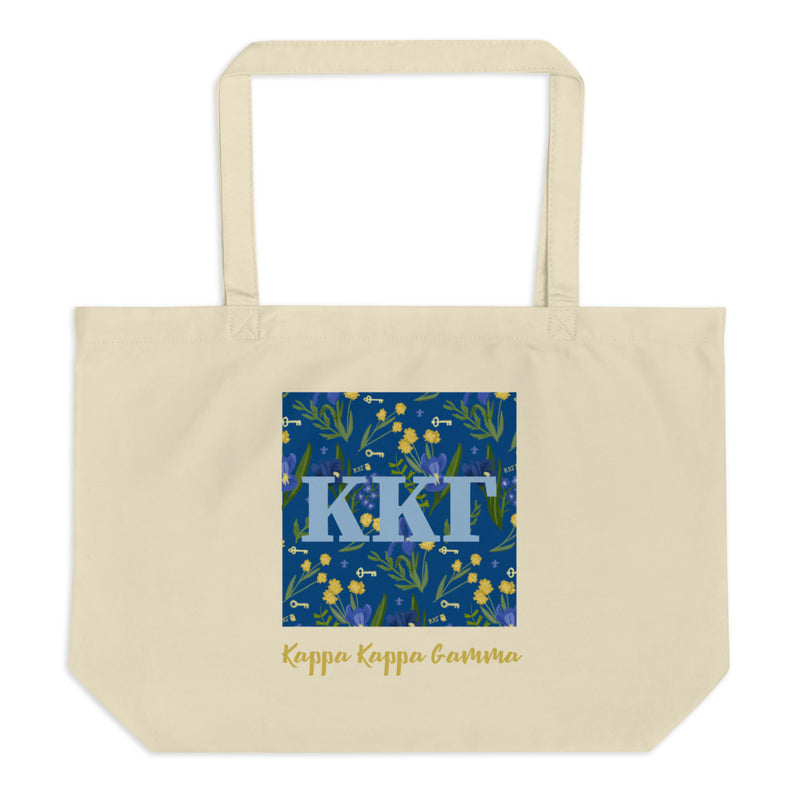 Kappa Kappa Gamma Greek Letters surrounded with a blue iris and key print printed on a natural canvas shopping tote.
