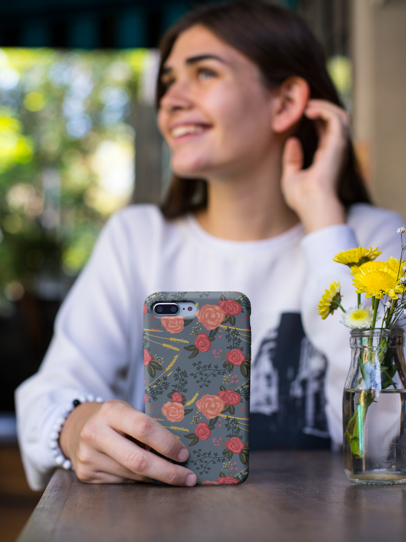 Alpha Omicron Pi Floral Pattern iPhone Case shown held by young woman
