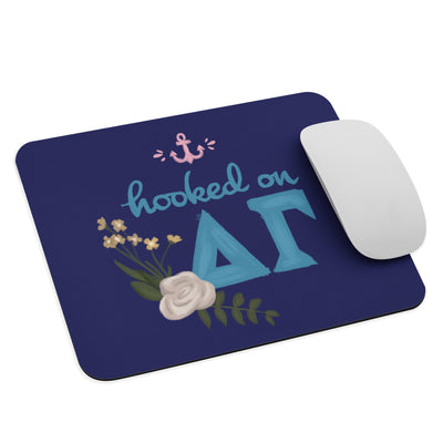 "Hooked on DG"  Mouse Pad in Navy Blue shown with mouse. 