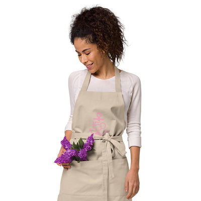 Delta Gamma 150th Anniversary Organic Cotton Apron shown in natural with pink logo