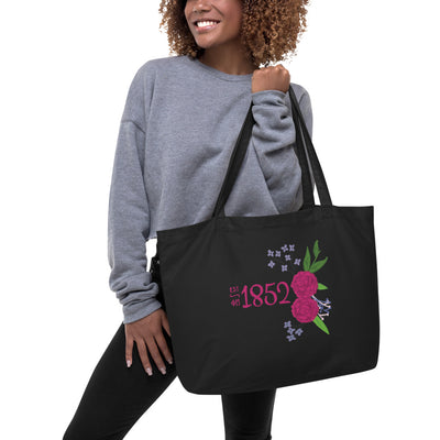 Phi Mu 1852 Large Organic Tote Bag in black shown on model's arm