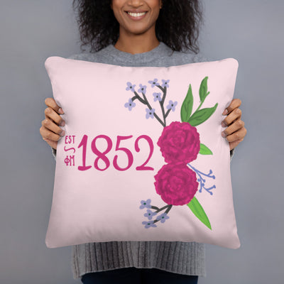 Phi Mu 1852 Reversible Pillow featuring hand drawn 1852 design in pink shown in model's hands