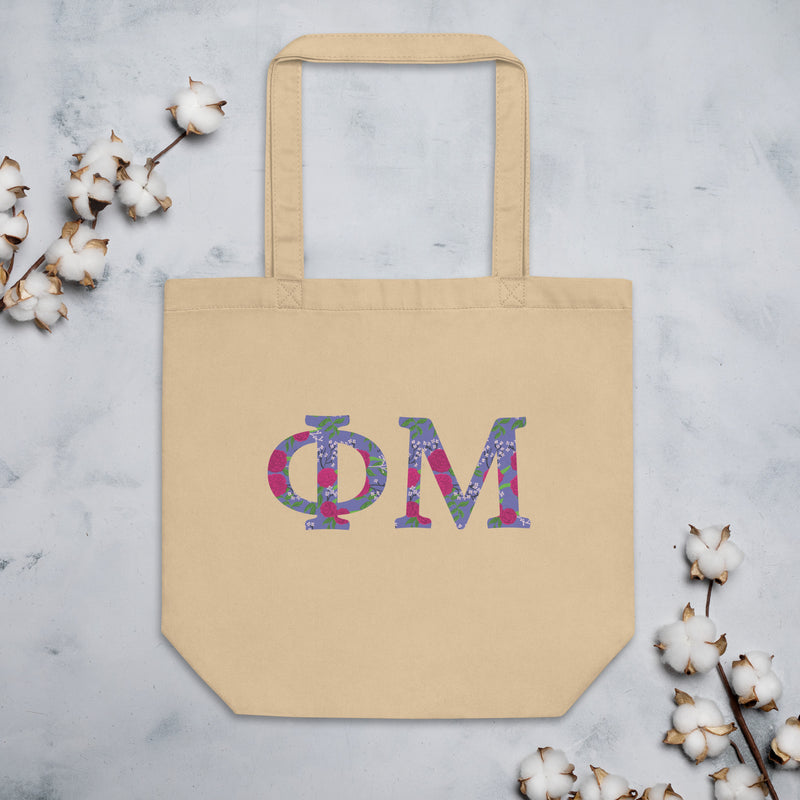 Phi Mu Filled Letters Eco Tote Bag in natural oyster shown flat with cotton blossoms