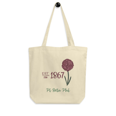 Pi Beta Phi 1867 Eco Tote Bag in natural oyster shown hanging on a hook