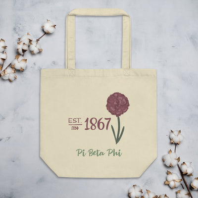 Pi Beta Phi 1867 Eco Tote Bag shown with cotton blossoms in natural laying flat