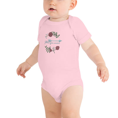 Pi Beta Phi motto baby onesie shown in pink with Pi Phi motto on front of baby model