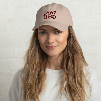 Pi Beta Phi 1867 Embroidered Baseball Hat in stone color shown on model's head