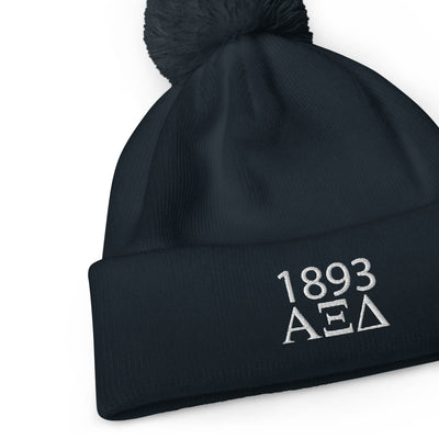 Alpha Xi Delta 1893 Founding Year Pom Pom Beanie in close up view
