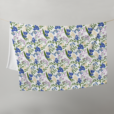 Sigma Alpha Epsilon Pi Floral Print Throw Blanket in white shown hanging on a clothesline
