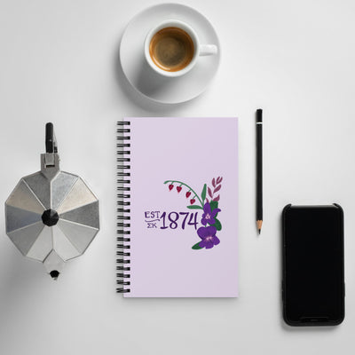 Sigma Kappa 1874 Spiral Notebook in lavender shown in lifestyle setting