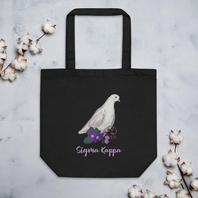 Sigma Kappa Dove Mascot Eco Tote Bag in black shown flat with cotton blossoms