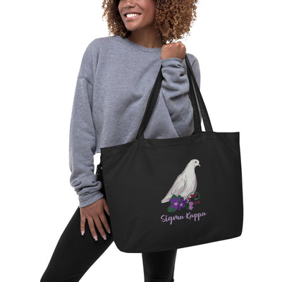 Sigma Kappa Dove Mascot Tote Bag in black shown on model's arm