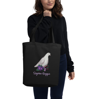Sigma Kappa Dove Mascot Eco Tote Bag in black shown on model's arm
