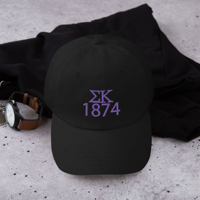 Sigma Kappa 1874 Embroidered Baseball Cap in black shown in lifestyle setting