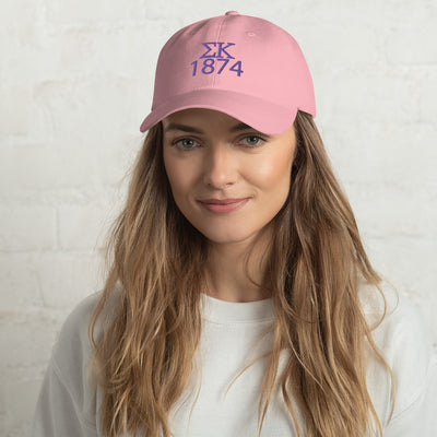 Sigma Kappa 1874 Embroidered Baseball Cap in pink shown on model's head