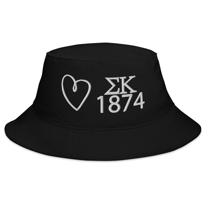 Sigma Kappa Heart Embroidered Bucket Hat in black shown with white embroidery on model&