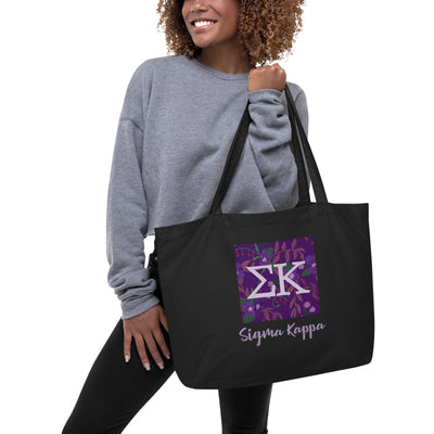 Sigma Kappa Greek Letters Tote Bag in black shown on model's arm