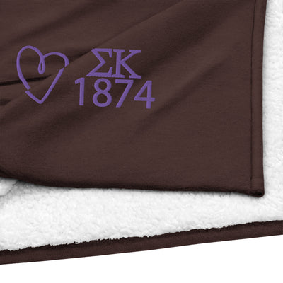 Sig Kap 1874 Plus Sherpa Blanket in brown with purple embroidery