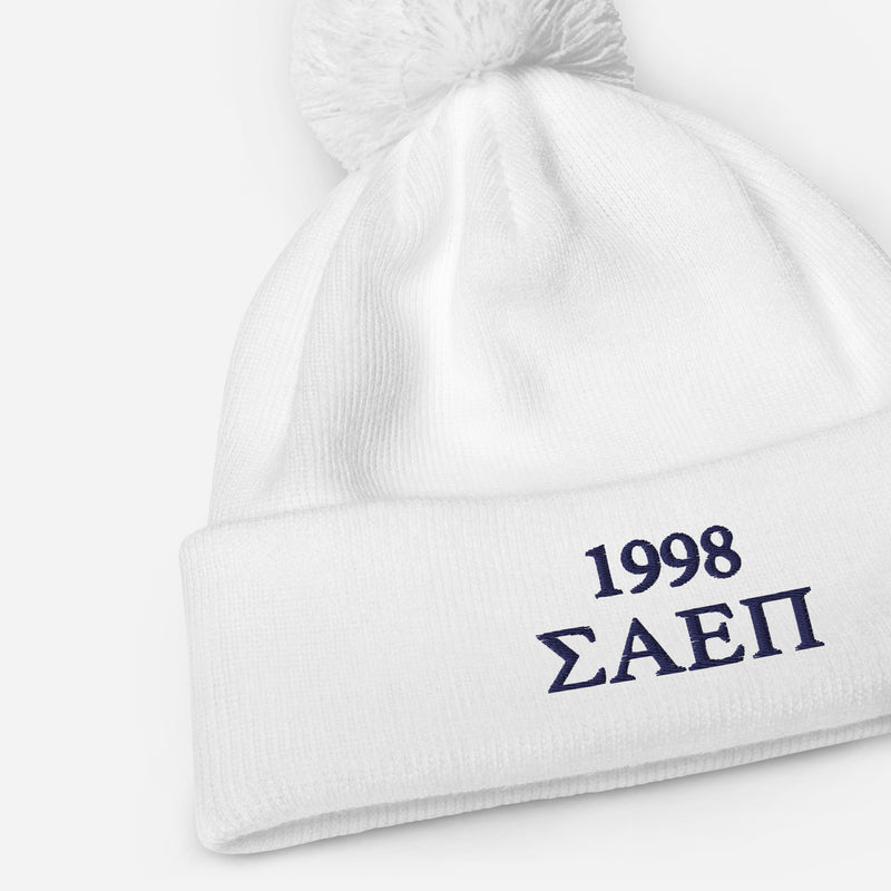 Sigma Alpha Epsilon Pi embroidered pom pom beanie in white showing product details