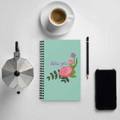 Delta Zeta Pink Killarney Rose Spiral Notebook shown with coffee