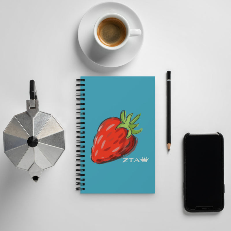 Zeta Tau Alpha Strawberry, Crown + ZTA Spiral Notebook shown with coffee