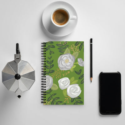 Kappa Delta White Rose Floral Print Spiral Notebook shown in office