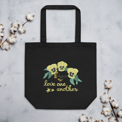 Kappa Alpha Theta Love One Another Eco Tote Bag in black shown flat with cotton