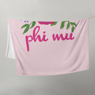 Phi Mu Carnation Design Pink Throw Blanket shown on clothesline